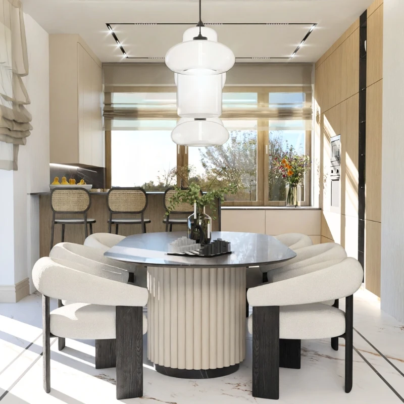 Elegancka jadalnia z okrągłym stołem i jasnymi fotelami przy dużym oknie