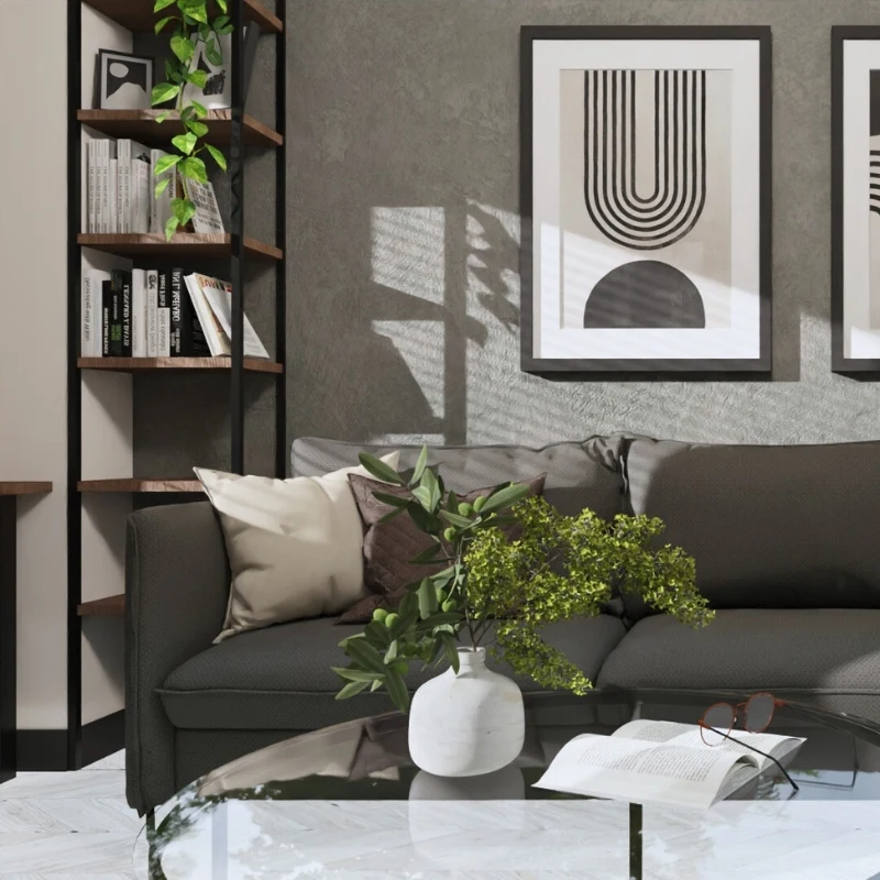 Nowoczesny salon z szaro-beżową sofą, szklanym stolikiem i minimalistycznymi dekoracjami.